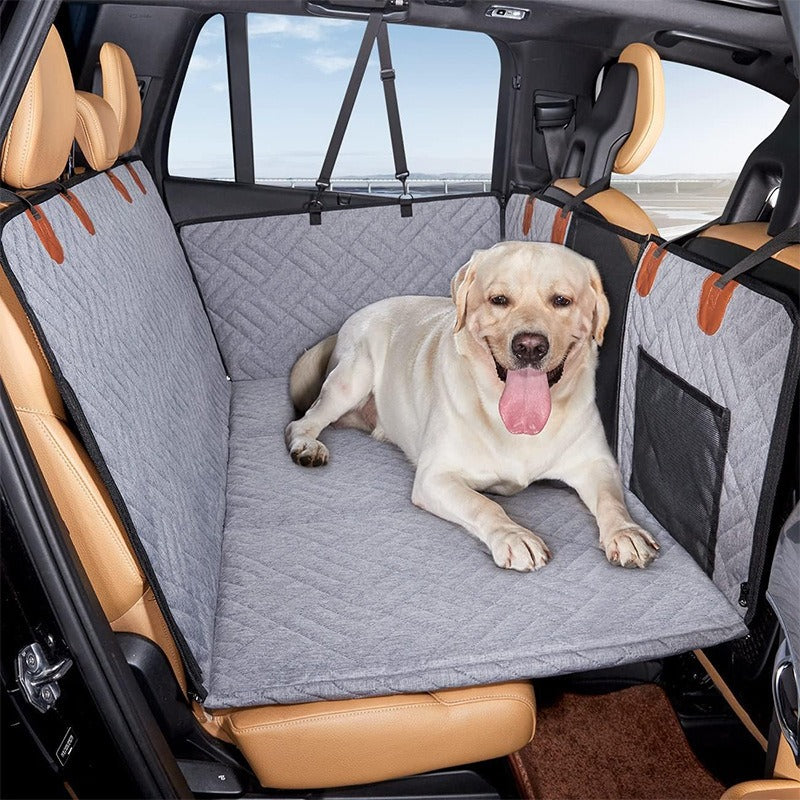 Car Life Premium Rear Seat Pet Hammock with mesh barrier, fully covering a car's back seat with a dog, demonstrating comprehensive protection, safety, and comfort for pet travel.