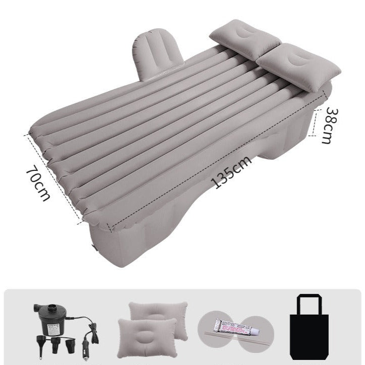 The Car Life Comfort Travel Air Mattress in gray, fully inflated and neatly fitting across the backseat of a modern SUV, ready for a comfortable rest.