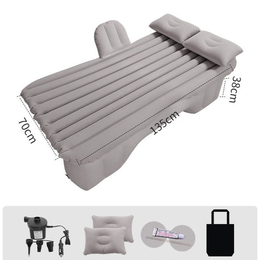 The Car Life Comfort Travel Air Mattress in gray, fully inflated and neatly fitting across the backseat of a modern SUV, ready for a comfortable rest.